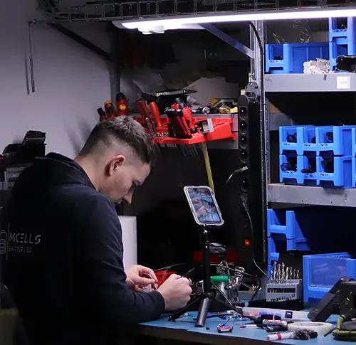 person soldering or repairing anything in workshop copy